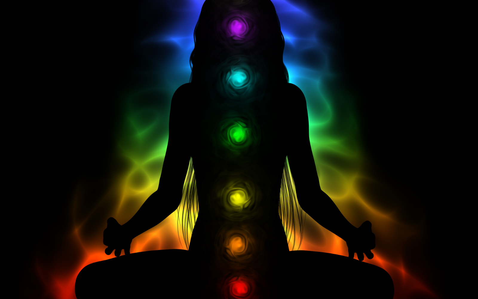woman sitting with colorful aura tracing her spine