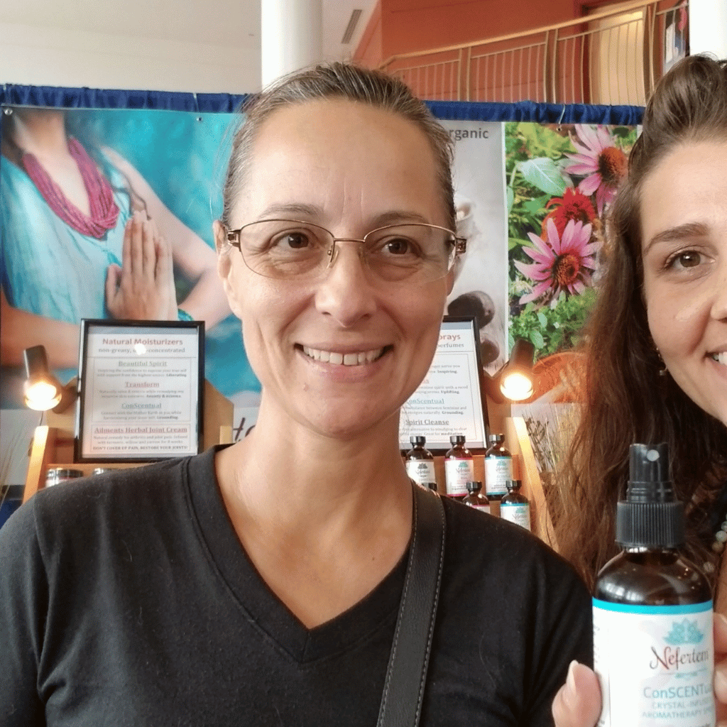 woman holding natural essential oil perfumes