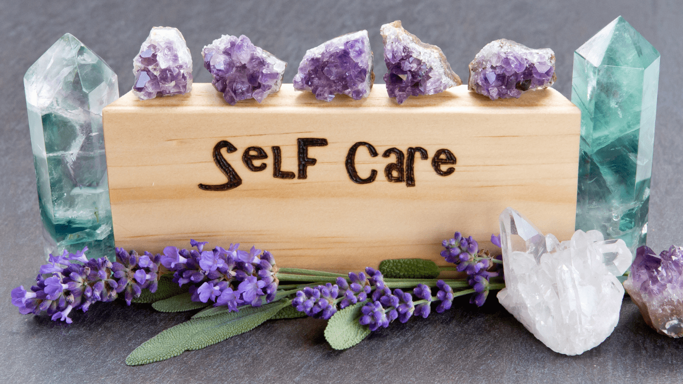 self care block surrounded by crystals and lavender