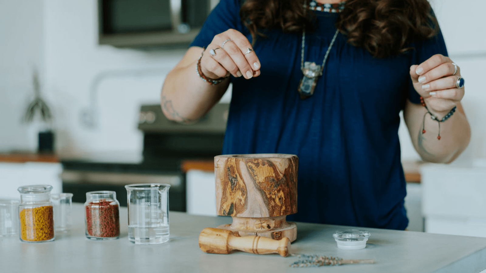 lady making natural soap by hand in kitchen