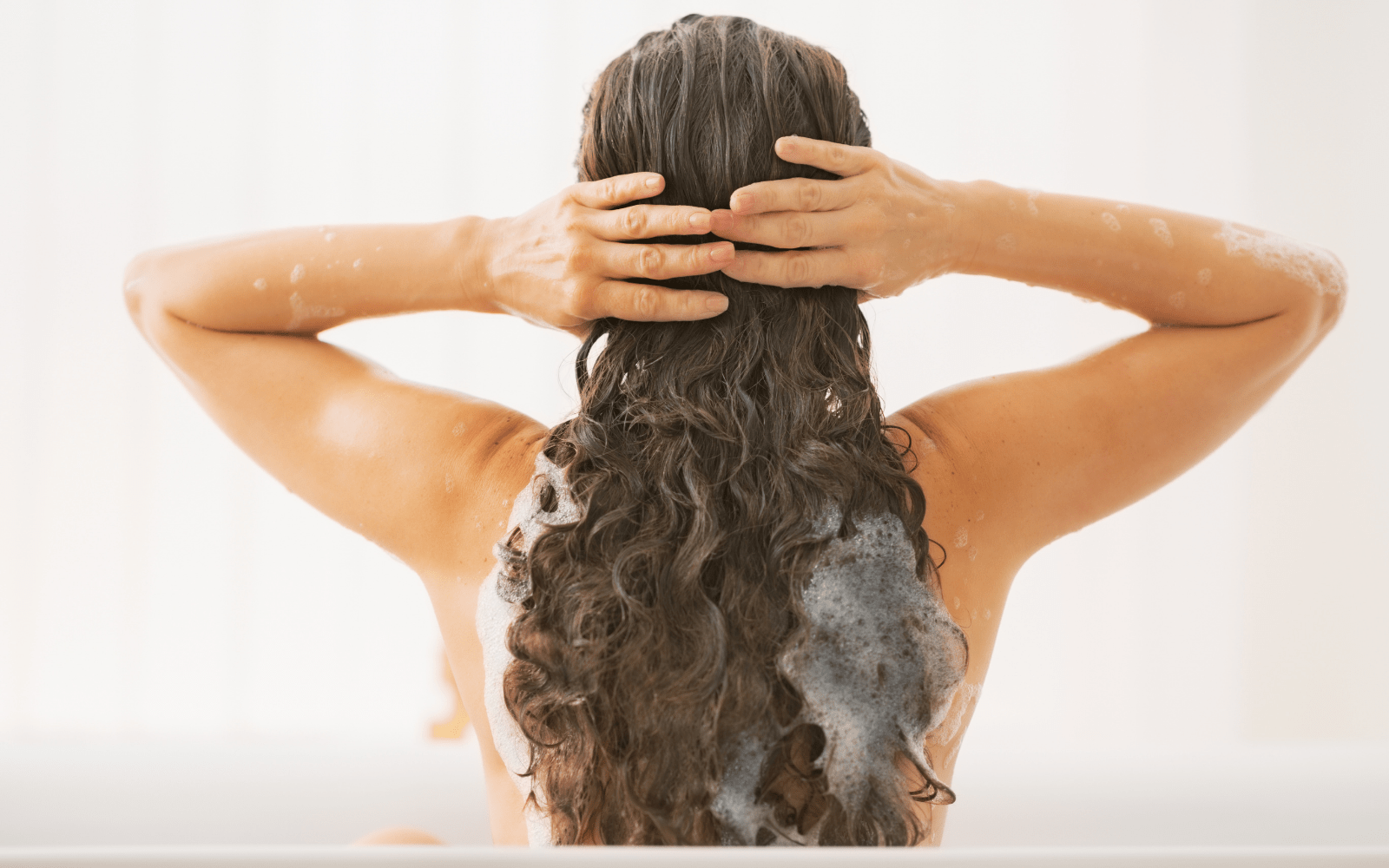 women in shower using nefertem skin care