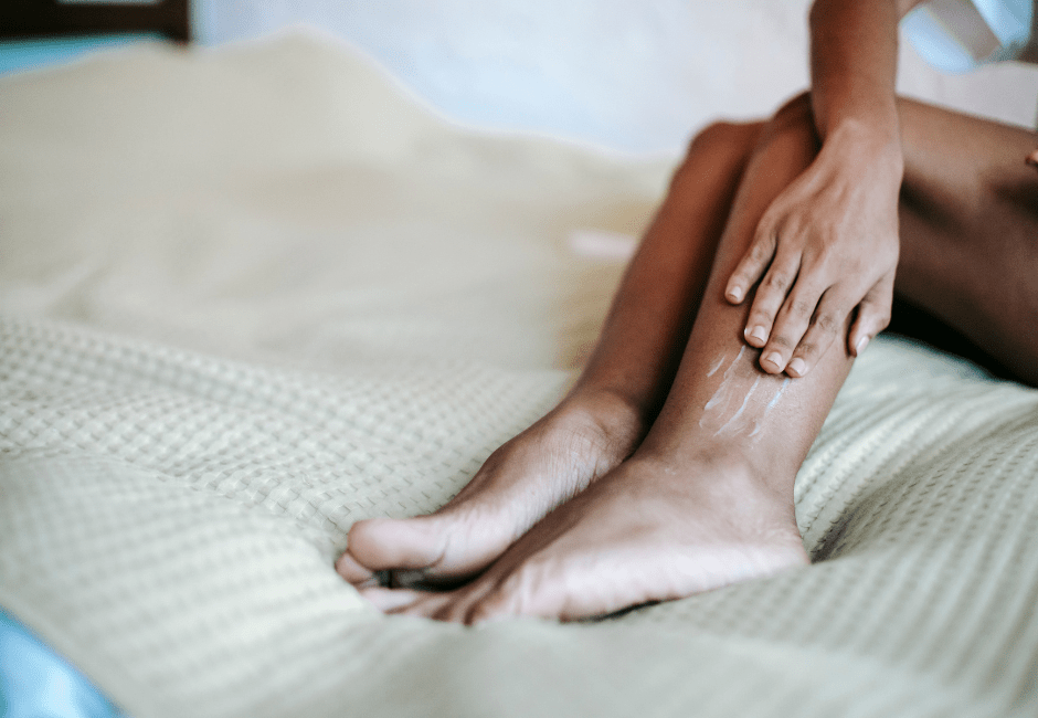 women moisturizing legs with nefertem moisturizer 