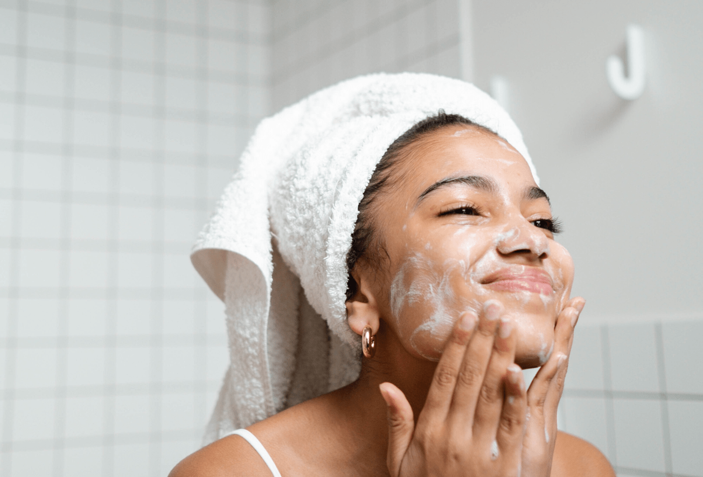 women washing face with nefertem skincare 