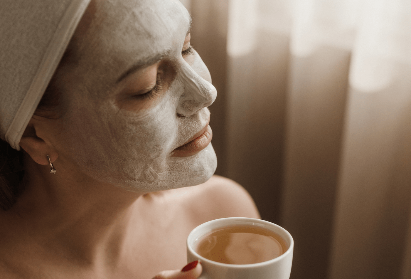women drinking coffee with face mask on 
