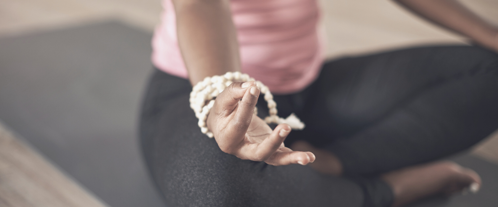woman manifesting goals while meditating