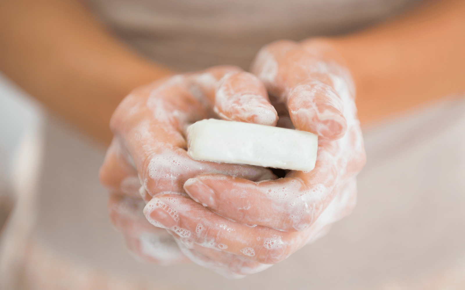 woman with tallow soap in hands