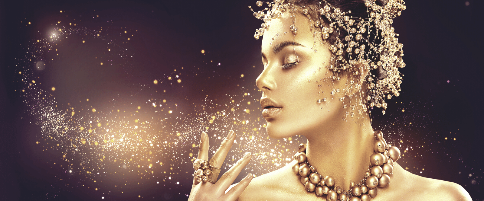 woman covered in gold by nefertem holistic skincare