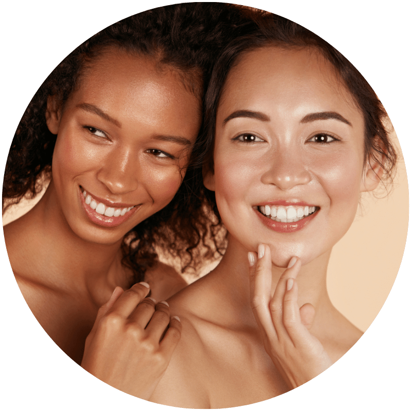 two women standing together after using Nefertem natural moisturizers