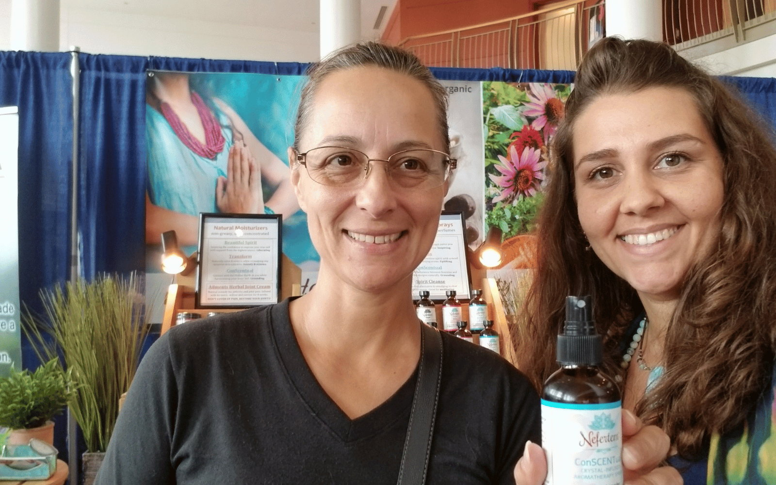 woman holding natural essential oil perfumes