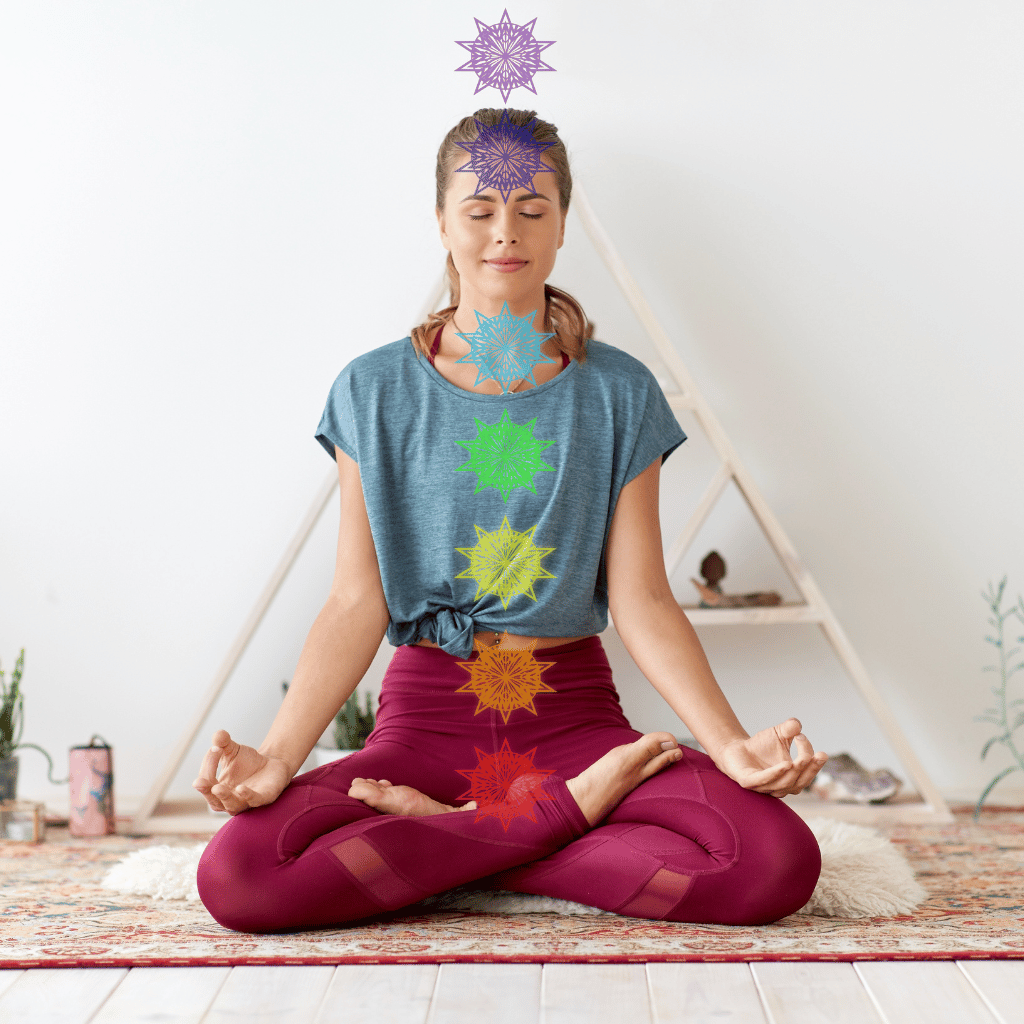 woman meditating with chakras over head