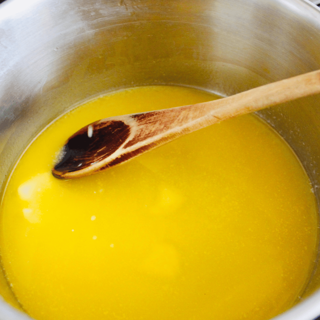 golden tallow simmering in pot