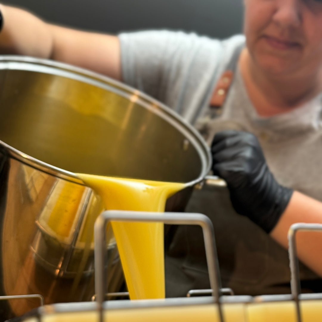 founder of nefertem pouring tallow soap liquid into molds