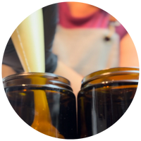 piping tallow moisturizers into jars