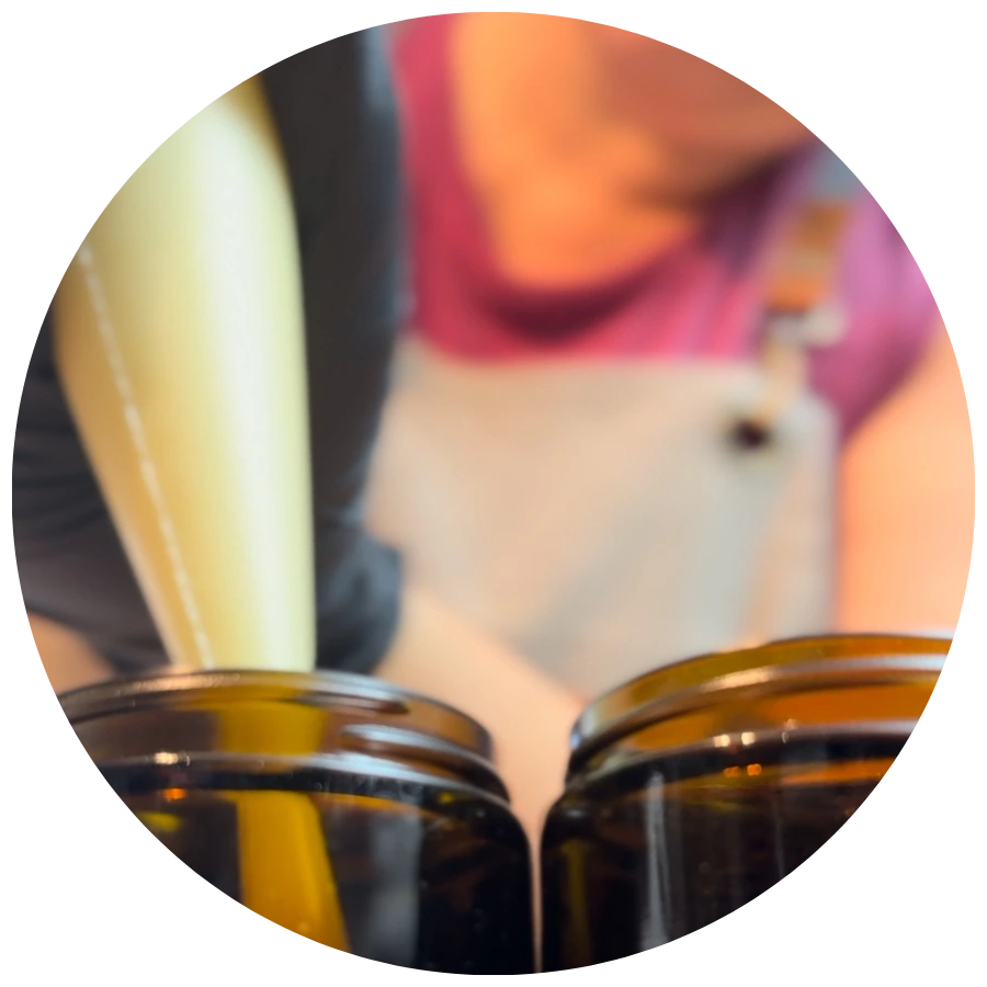 showing how we pipe the tallow moisturizers into jars